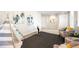Bonus room featuring ample space, stylish decor, and cozy seating at 8571 Gold Peak Dr # F, Highlands Ranch, CO 80130