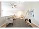 Bonus room with stylish seating, ceiling fan and a playful teepee at 8571 Gold Peak Dr # F, Highlands Ranch, CO 80130