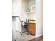 Cozy office nook with wooden drawers, granite desktop, decor, and chrome office chair at 8571 Gold Peak Dr # F, Highlands Ranch, CO 80130