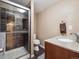 Bathroom featuring a granite countertop, modern shower, and sleek fixtures at 8766 Cresthill Ln, Highlands Ranch, CO 80130