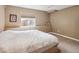 Bedroom with neutral walls, carpet, window and ledge space for décor at 8766 Cresthill Ln, Highlands Ranch, CO 80130