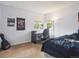 Bedroom featuring neutral colors and a dedicated desk area by the window, creating a perfect study space at 8766 Cresthill Ln, Highlands Ranch, CO 80130