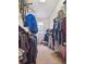 Well-organized walk-in closet with ample hanging space, shelving, and storage, perfect for keeping your wardrobe tidy at 8766 Cresthill Ln, Highlands Ranch, CO 80130