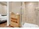Clean bathroom with shower, storage cabinet and wood floors at 1800 Lawrence St # 505, Denver, CO 80202