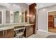 Elegant bathroom with double vanity and walk-in closet at 1800 Lawrence St # 505, Denver, CO 80202