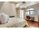 Charming bedroom with built-in workspace and city view at 1800 Lawrence St # 505, Denver, CO 80202
