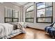 Bright bedroom with hardwood floors and large windows at 1800 Lawrence St # 505, Denver, CO 80202