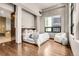 Spacious bedroom with hardwood floors and city views at 1800 Lawrence St # 505, Denver, CO 80202