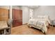 Cozy bedroom with built-in wardrobe and hardwood floors at 1800 Lawrence St # 505, Denver, CO 80202