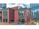 Brick building exterior with balconies and city views at 1800 Lawrence St # 505, Denver, CO 80202