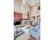 High-ceiling living room with a fireplace and ample seating at 1800 Lawrence St # 505, Denver, CO 80202