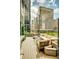 Urban rooftop patio with seating area and city views at 1800 Lawrence St # 505, Denver, CO 80202