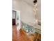 Glass and wood staircase overlooking the living area at 1800 Lawrence St # 505, Denver, CO 80202