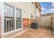 Patio view of back exterior and AC unit at 3667 W Union Ave # 2E, Denver, CO 80236