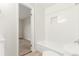 Clean bathroom with white subway tile, tub, and new fixtures at 3667 W Union Ave # 2E, Denver, CO 80236