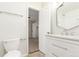 Bright bathroom with modern vanity, fixtures, and mirror, located off the bedroom at 3667 W Union Ave # 2E, Denver, CO 80236