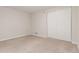 Bedroom featuring a closet with sliding doors and neutral carpet at 3667 W Union Ave # 2E, Denver, CO 80236