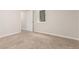 Bedroom with neutral carpet and a door leading to another room at 3667 W Union Ave # 2E, Denver, CO 80236