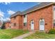 A townhome community with brick exteriors and green lawns at 3667 W Union Ave # 2E, Denver, CO 80236