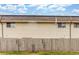 Townhome exterior, featuring wooden fence for privacy at 3667 W Union Ave # 2E, Denver, CO 80236