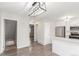 Open floor plan with modern kitchen featuring stainless steel appliances and bar top seating at 3667 W Union Ave # 2E, Denver, CO 80236
