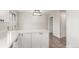Bright kitchen featuring white cabinets, countertops and stainless steel appliances at 3667 W Union Ave # 2E, Denver, CO 80236