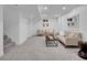 Finished basement features a cozy seating area with plush carpeting and neutral tones, perfect for relaxation at 7126 Joan St, Denver, CO 80221