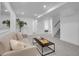 Basement living area offering cozy seating, stairs to the upper level and ample lighting, ideal for relaxing at 7126 Joan St, Denver, CO 80221