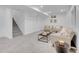 Spacious basement with neutral carpet, cozy furniture, and ample lighting for a versatile living area at 7126 Joan St, Denver, CO 80221