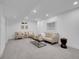 Inviting basement featuring comfortable seating, neutral decor, and ample space for entertainment and relaxation at 7126 Joan St, Denver, CO 80221