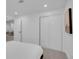A bedroom view highlighting closet space and a doorway to a living area at 7126 Joan St, Denver, CO 80221