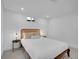 Bright bedroom with a comfortable bed, matching side tables and neutral decor at 7126 Joan St, Denver, CO 80221