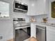 Kitchen featuring stainless steel appliances and a light, bright, and modern design at 7126 Joan St, Denver, CO 80221