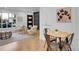 Bright living room adjacent to a dining area, showcasing a cozy and inviting space at 7126 Joan St, Denver, CO 80221