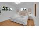 Serene main bedroom with large windows, neutral decor, and a comfortable, relaxing atmosphere at 7126 Joan St, Denver, CO 80221