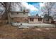 Back exterior of home featuring a large patio area and fenced-in backyard space at 13778 W 71St Pl, Arvada, CO 80004