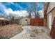 Backyard featuring a storage shed and fenced-in space at 13778 W 71St Pl, Arvada, CO 80004