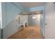 Unfinished basement space with carpet and painted blue walls and ceiling at 13778 W 71St Pl, Arvada, CO 80004