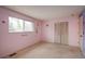 Bright bedroom featuring carpeted floors, bright walls, and natural light at 13778 W 71St Pl, Arvada, CO 80004