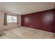 Relaxing bedroom with carpeted flooring, large window, and bright paint at 13778 W 71St Pl, Arvada, CO 80004