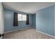 Comfortable bedroom with carpeted flooring, great natural light, and ample wall space at 13778 W 71St Pl, Arvada, CO 80004