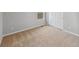 Bright bedroom with neutral walls, carpet, closet, and natural light from the window at 2154 Alyssa St, Fort Lupton, CO 80621