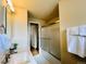 This bathroom showcases a tub/shower combo, a sink with white countertop, and ample lighting at 2543 Westchester Dr, Denver, CO 80221