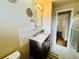 This bathroom features a single sink, a large mirror, and neutral tones at 2543 Westchester Dr, Denver, CO 80221