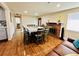 Bright dining room with hardwood floors and fireplace at 2543 Westchester Dr, Denver, CO 80221