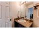 Well-lit bathroom featuring an undermount sink and vanity at 19149 E 55Th Ave, Denver, CO 80249