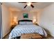 Serene bedroom with a decorative ceiling fan, well lit space and a comfy bed setting the stage for relaxation at 19149 E 55Th Ave, Denver, CO 80249