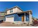 Charming two-story home with a two-car garage and inviting front porch at 19149 E 55Th Ave, Denver, CO 80249