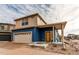 Two-story craftsman style home with a blue exterior and a covered porch at 19149 E 55Th Ave, Denver, CO 80249