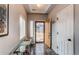 Welcoming foyer features modern lighting, sleek flooring and a glass console table with an inviting entryway at 19149 E 55Th Ave, Denver, CO 80249
